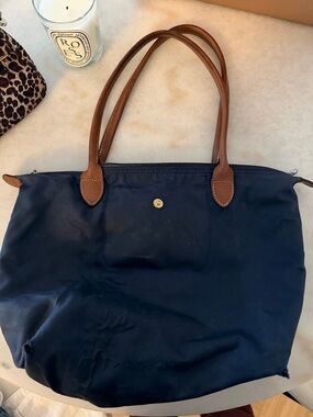 Heavily used Longchamp navy medium size bag